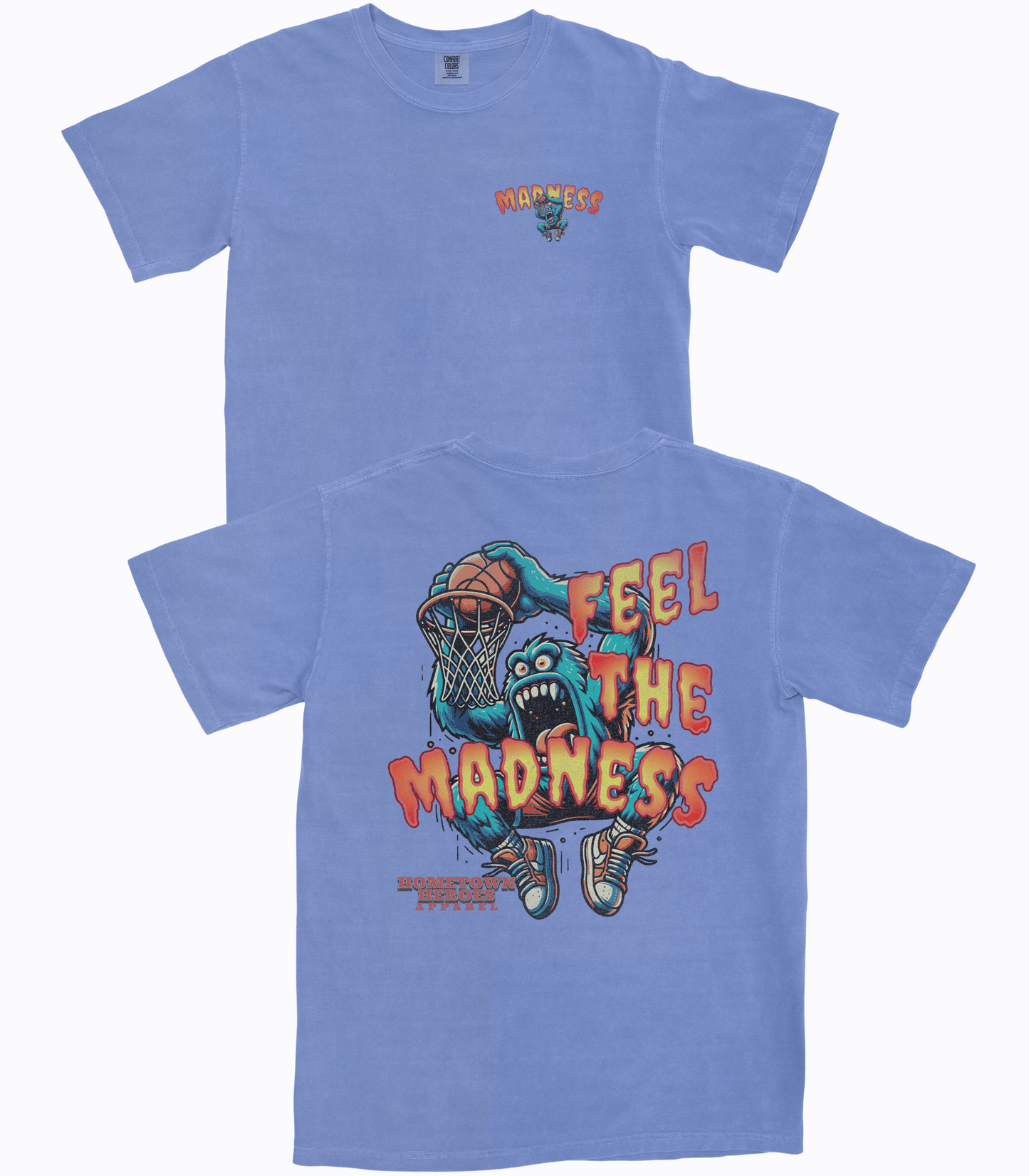 Blue t-shirt with a graphic design of a creature playing basketball and text 'Feel the Madness' on a white background.