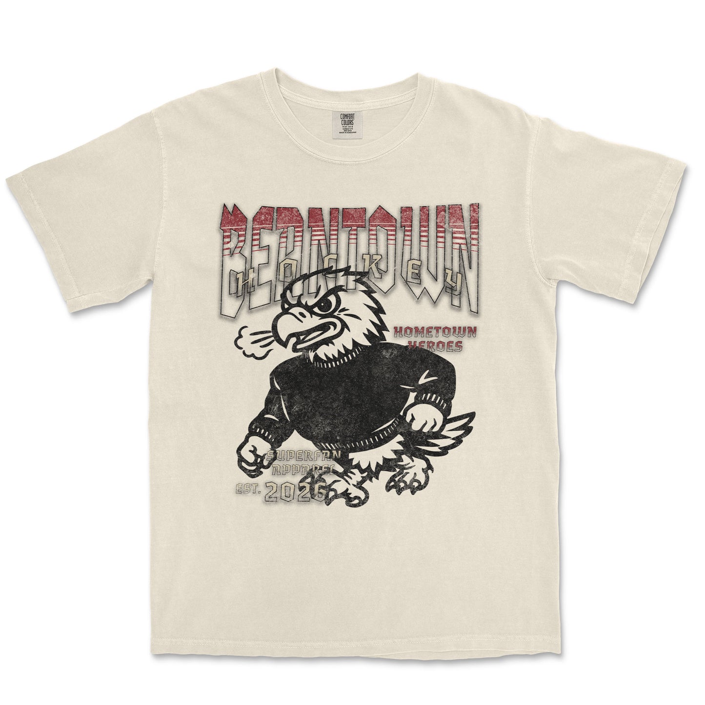 Beige t-shirt with graphic design of an eagle and text on a white background