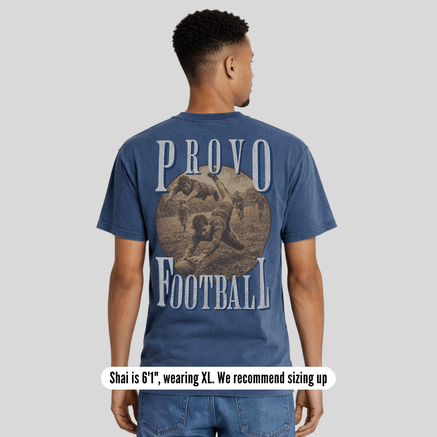 Man wearing a blue t-shirt with 'Provo Football' design on the back, standing against a plain background.