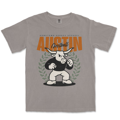 Gray t-shirt with a graphic of a bull and 'Austin Football' text on a white background
