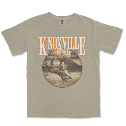 Beige t-shirt with 'Knoxville Football' graphic on a white background