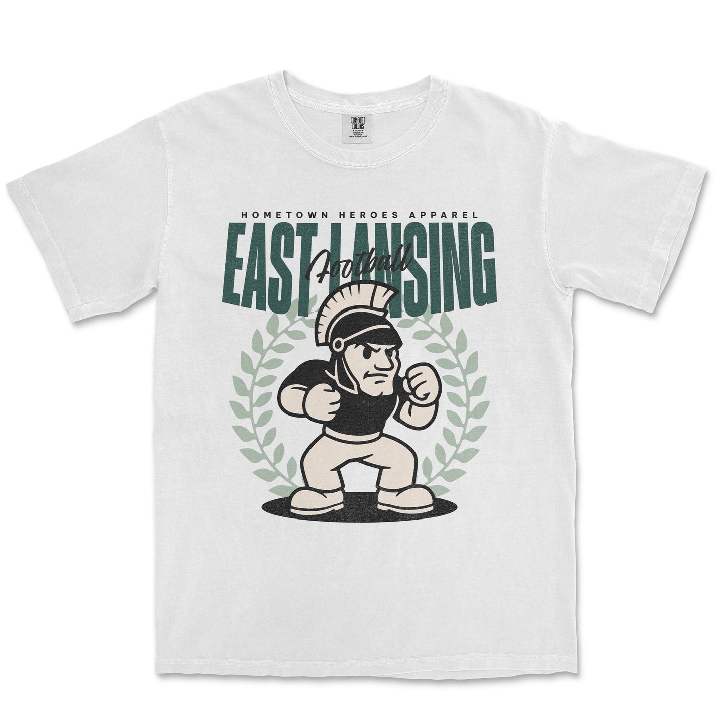 White t-shirt with 'East Lansing' graphic design featuring a cartoon character and laurel wreath on a white background.