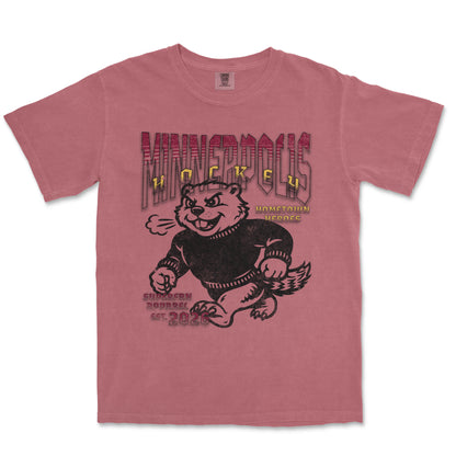Pink t-shirt with graphic design of a bear and text on a white background