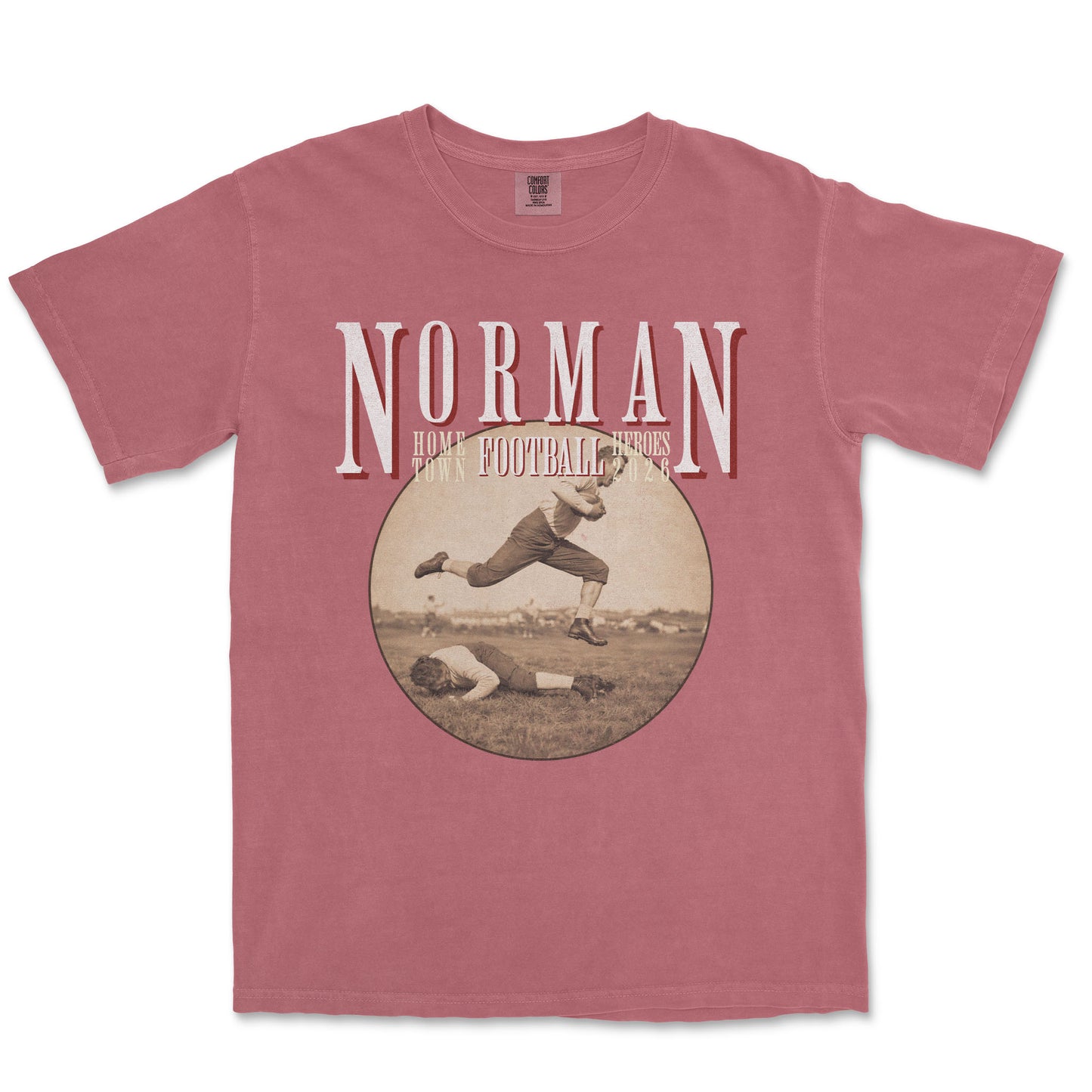 Red t-shirt with vintage football graphic and 'Norman' text on a white background