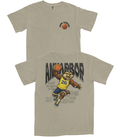 Beige t-shirt with a bear holding a basketball and 'Ann Arbor' text on a white background