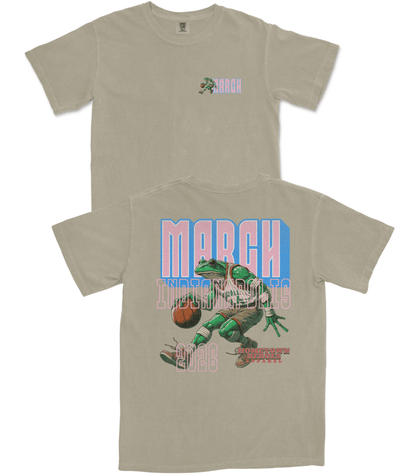 Beige t-shirt with a graphic design of a frog playing basketball and text on a white background