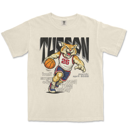 Beige t-shirt with a tiger graphic holding a basketball and text on a white background
