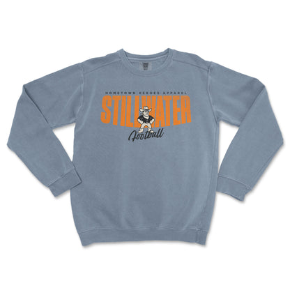 Blue sweatshirt with 'Stillwater Football' text and logo on a white background