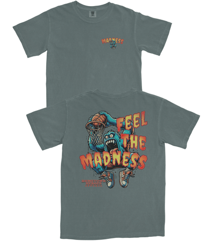 Gray t-shirt with a graphic design of a monster playing basketball and text 'FEEL THE MADNESS' on a white background.