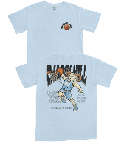 Light blue t-shirt with a graphic of a ram playing basketball and text on a white background