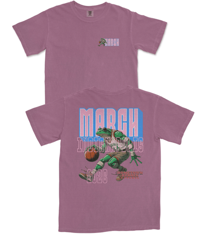 Purple t-shirt with a graphic of a frog playing basketball and 'March 2026' text on a white background.