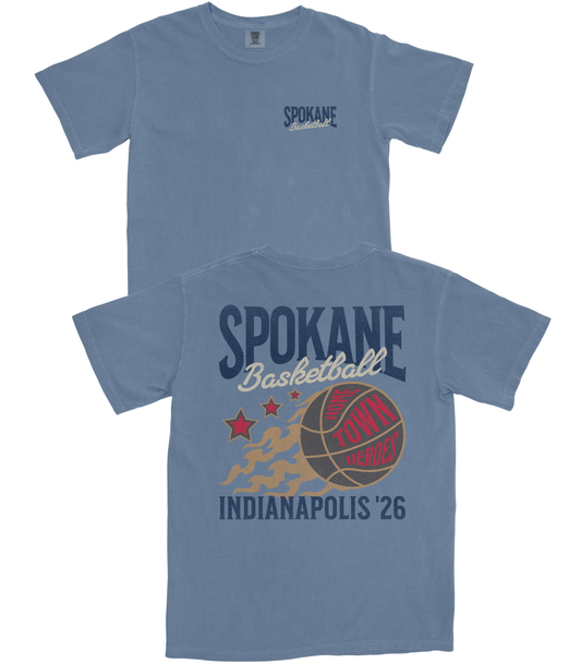 Blue t-shirt with 'Spokane Basketball' graphic design on a white background