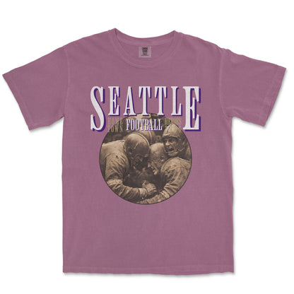 Purple t-shirt with 'Seattle Football' graphic on a white background