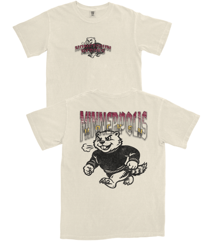 Two cream-colored t-shirts with graphic designs on a white background