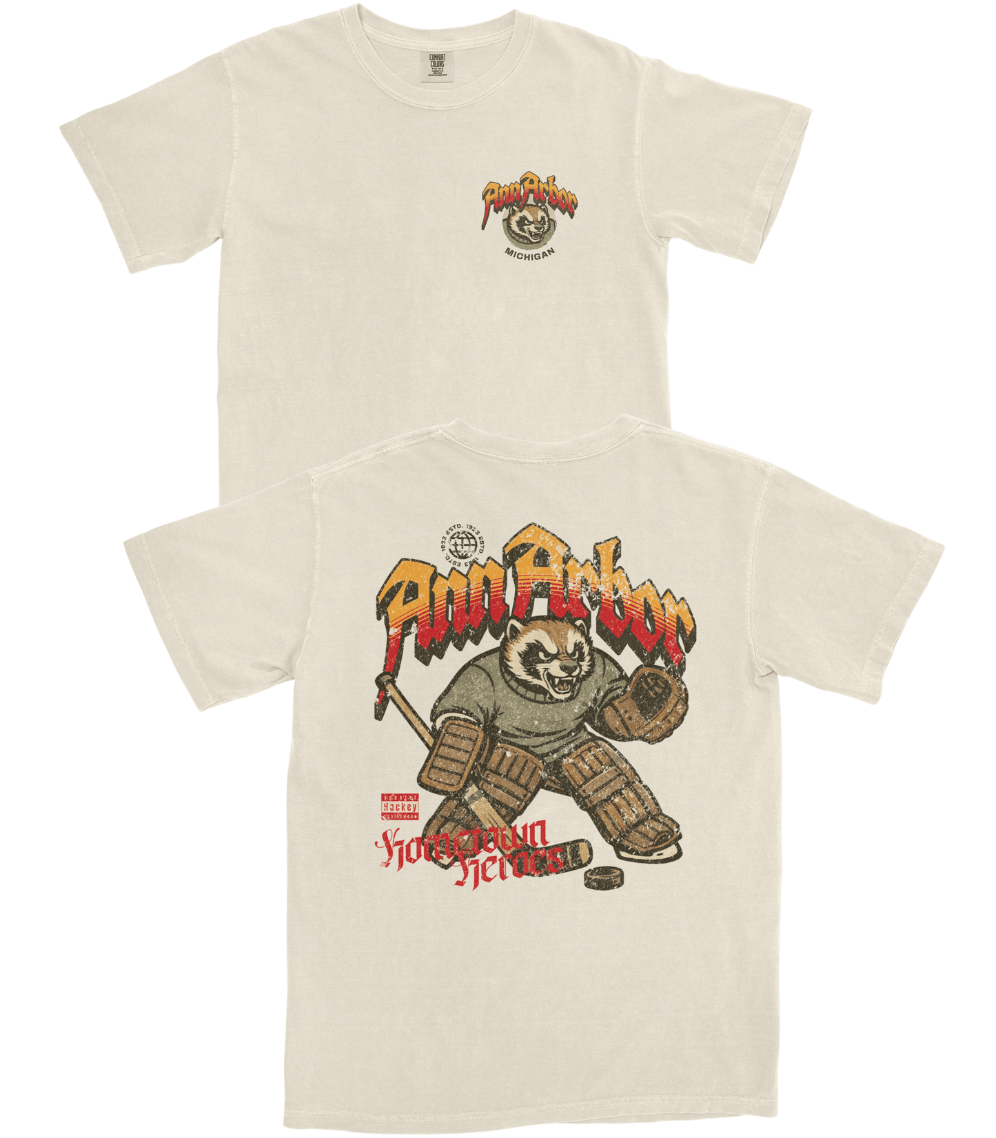 Beige t-shirt with graphic design of a bear hockey player and text on a white background