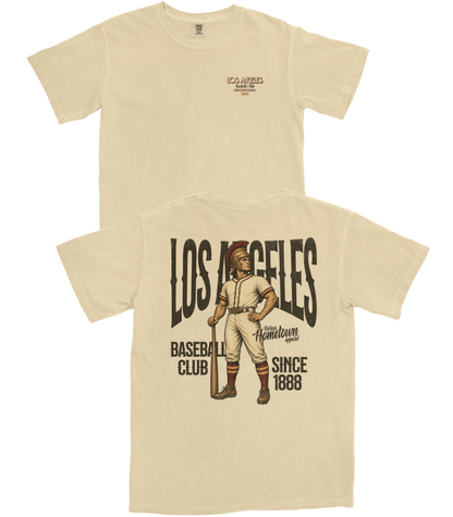 Beige t-shirt with vintage baseball player graphic and text on a white background