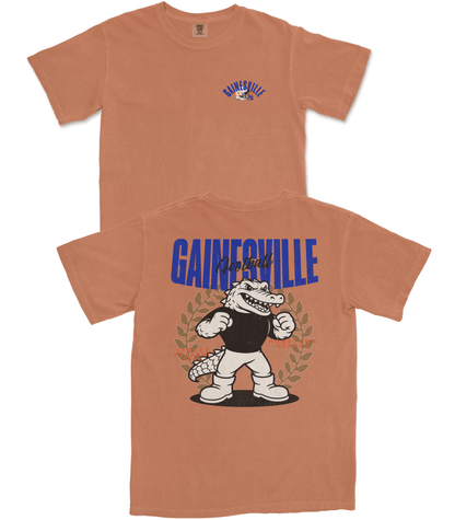 Brown t-shirt with cartoon alligator and 'GAINESVILLE' text on a white background