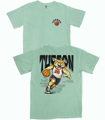 Light green t-shirt with a tiger basketball player graphic and 'Tusson' text on a white background