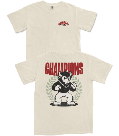 Beige t-shirt with graphic design of a bear and 'Champions' text on a white background