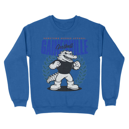 Blue sweatshirt with a cartoon alligator and 'Gainesville' text on a white background