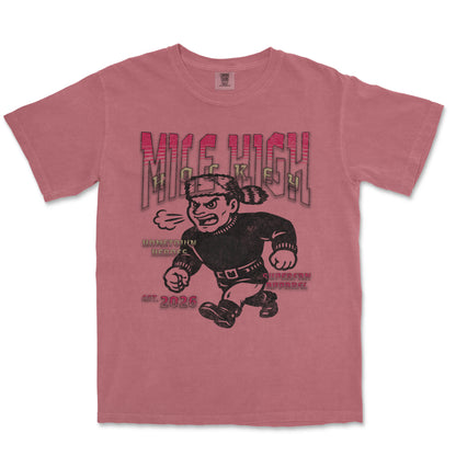 Pink t-shirt with a graphic design of a cartoon character and text on a white background