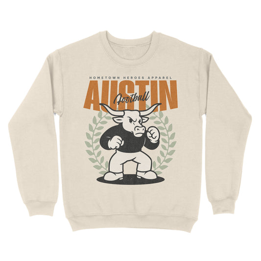 Beige sweatshirt with a graphic of a bull and text on a white background
