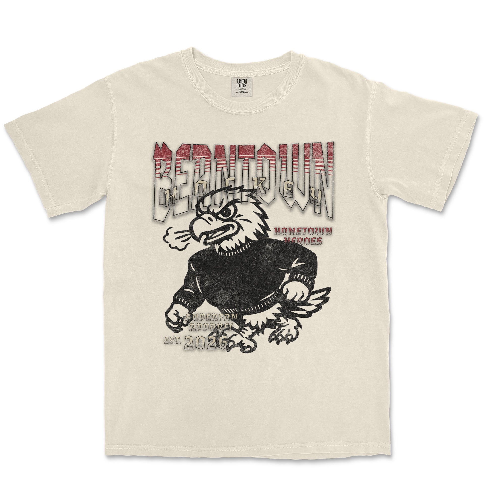 Beige t-shirt with graphic design of an eagle and text on a white background