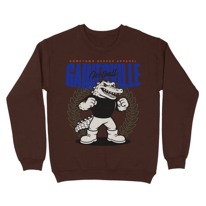 Brown sweatshirt with cartoon alligator and 'Gainesville' text on a white background