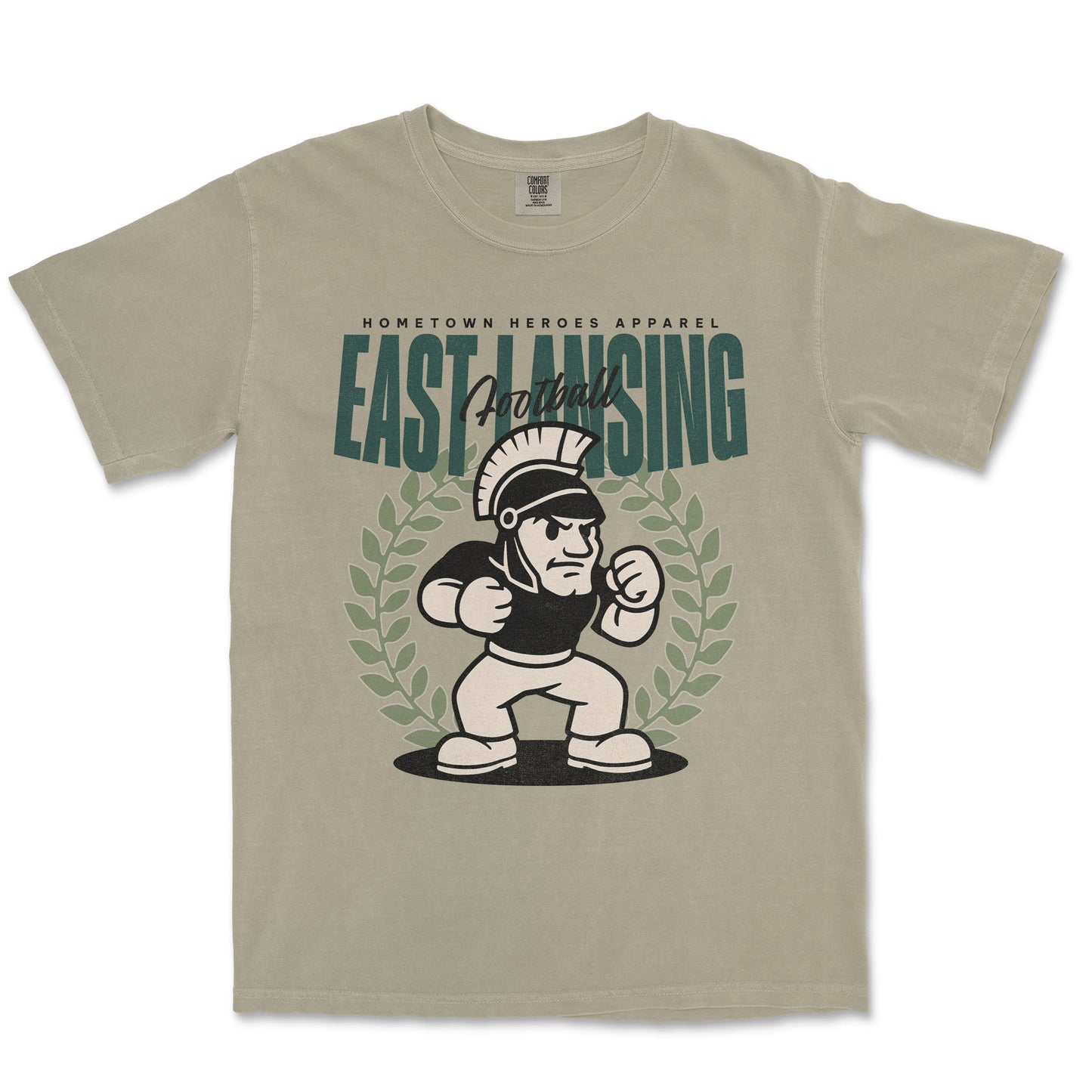 Beige t-shirt with 'East Lansing Football' graphic design on a white background