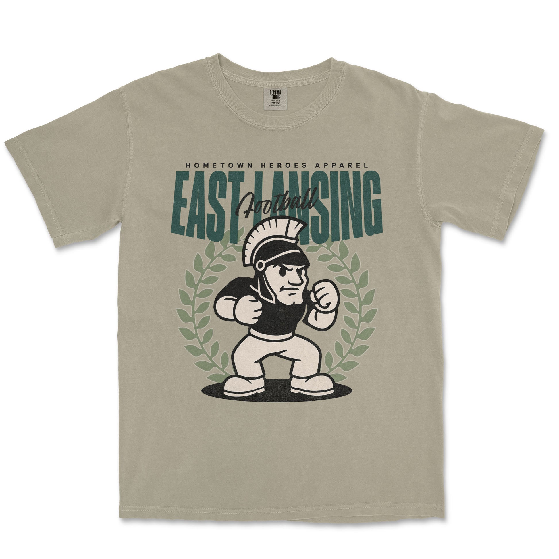 Beige t-shirt with 'East Lansing Football' graphic design on a white background