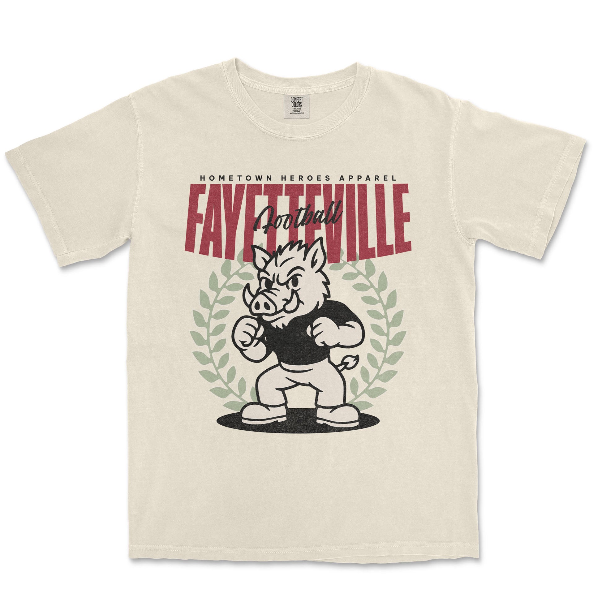 Beige t-shirt with a graphic of a boar mascot and text 'Fayetteville Football' on a white background