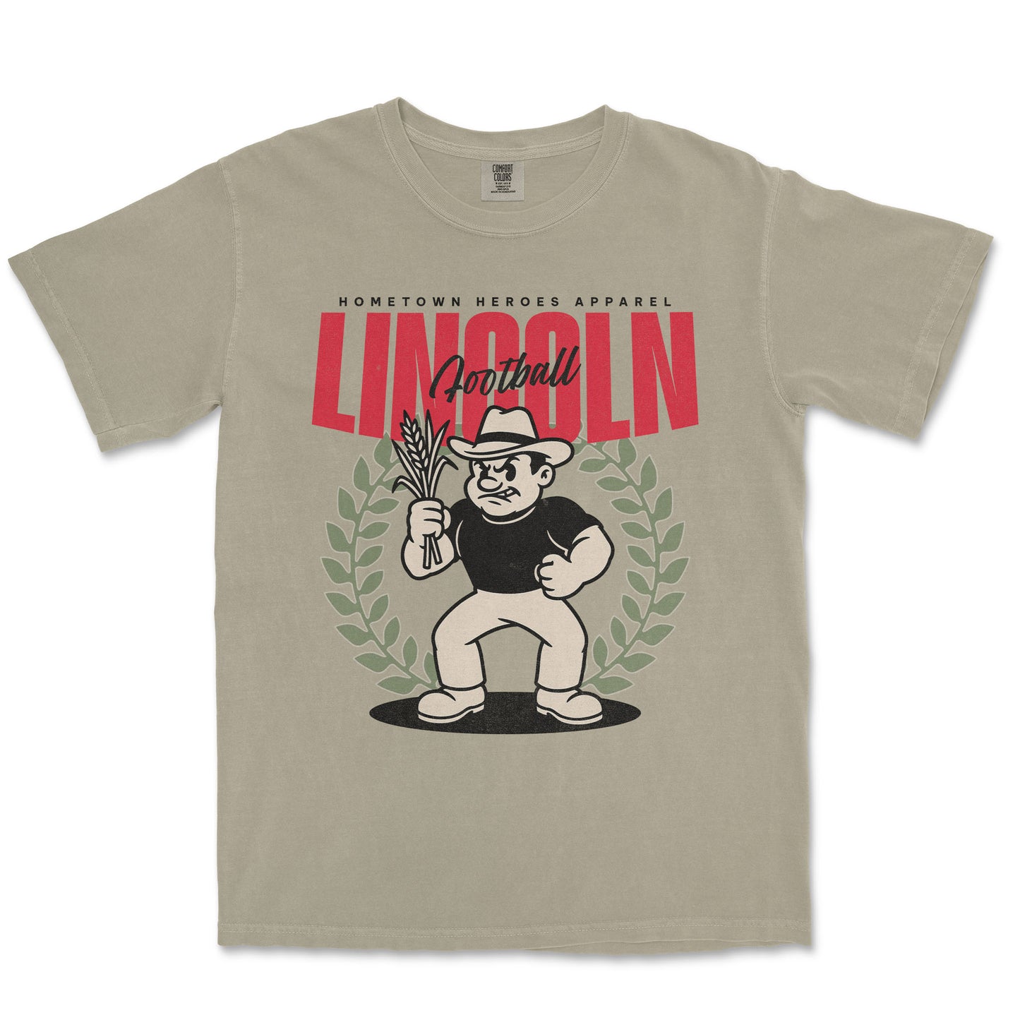 Beige t-shirt with a graphic design featuring a character holding corn and the word 'Lincoln'.