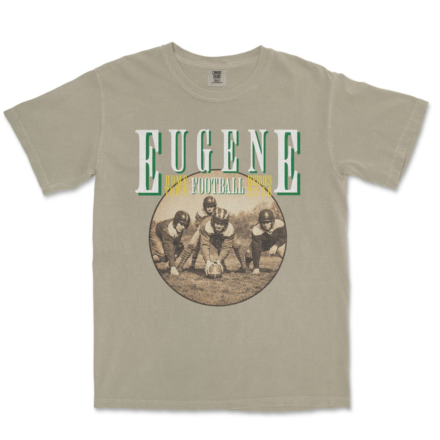 Beige t-shirt with vintage football graphic and 'Eugene' text on a white background