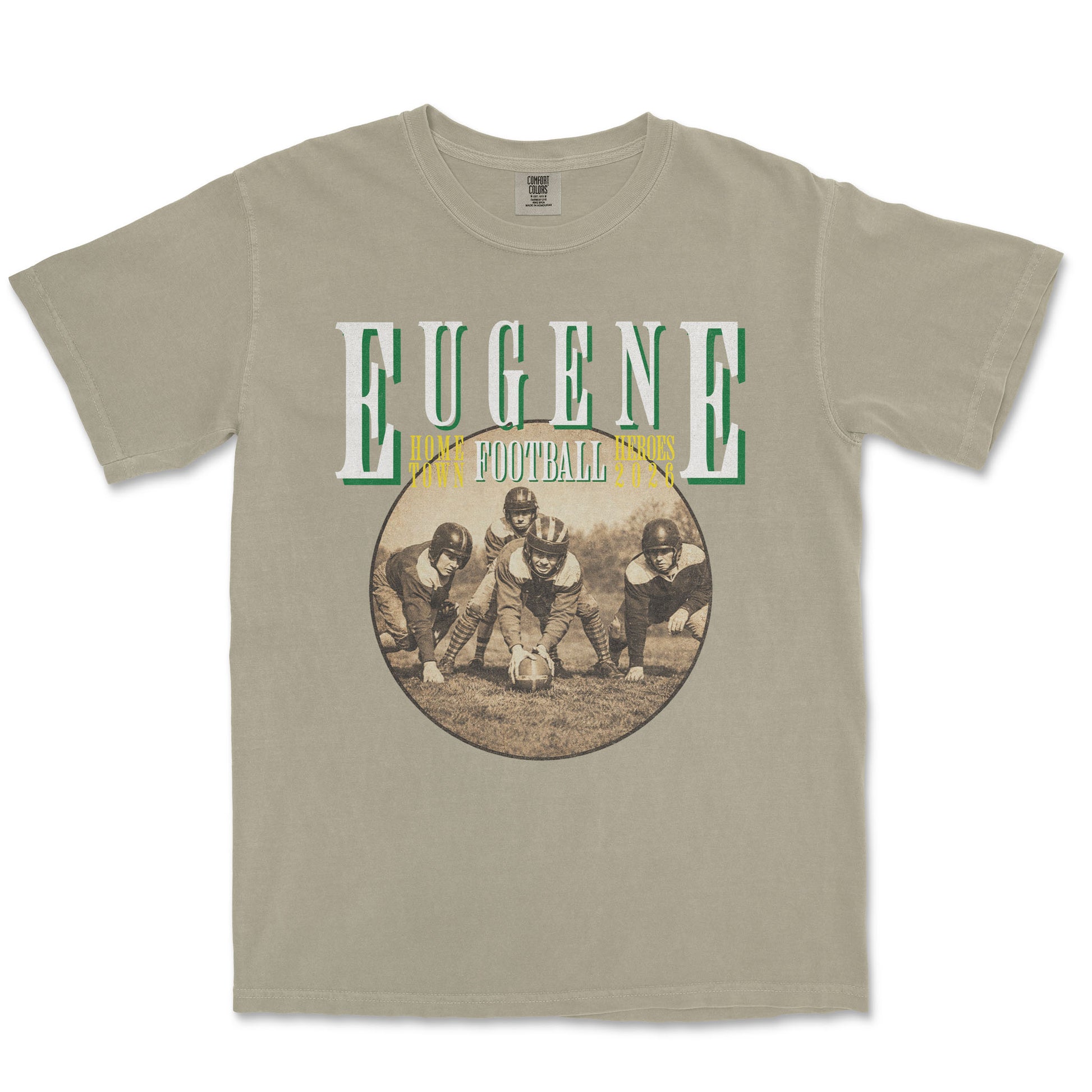 Beige t-shirt with vintage football graphic and 'Eugene' text on a white background