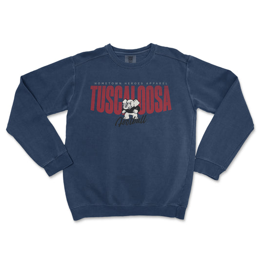 Blue sweatshirt with 'Tuscaloosa' text and graphic on a white background
