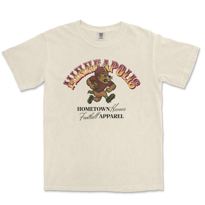 Beige t-shirt with graphic design of a bear and text on a white background