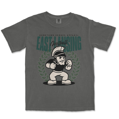 Gray t-shirt with a graphic of a mascot and text on a white background