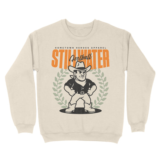 Beige sweatshirt with a graphic of a football player and 'Stillwater' text on a white background
