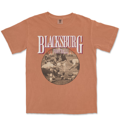 Brown t-shirt with 'Blacksburg Football' graphic on a white background
