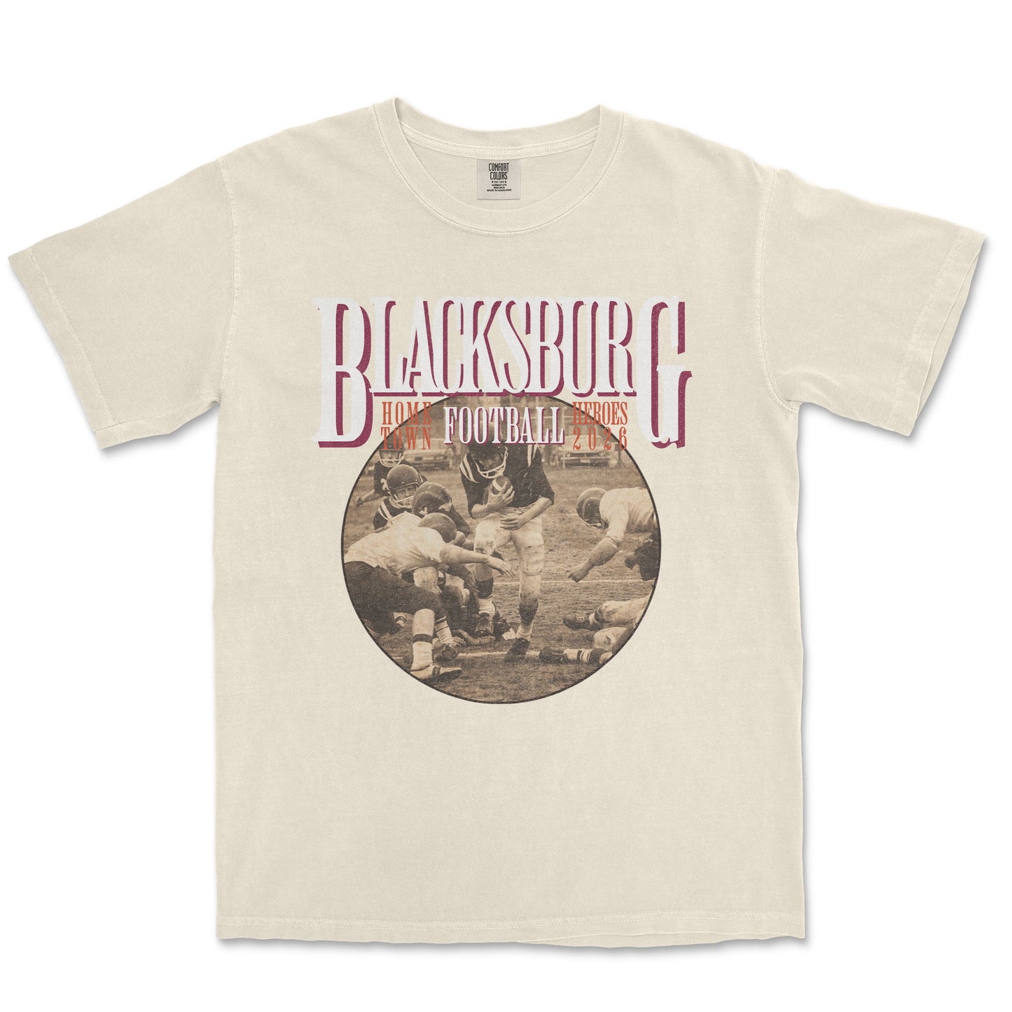 Beige t-shirt with 'Blacksburg Football' graphic on a white background