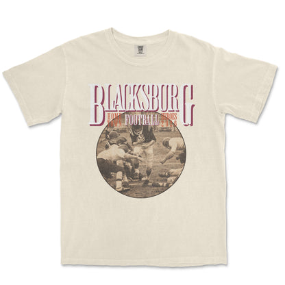 Beige t-shirt with 'Blacksburg Football' graphic on a white background