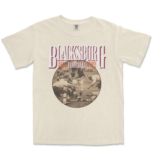 Beige t-shirt with 'Blacksburg Football' graphic on a white background