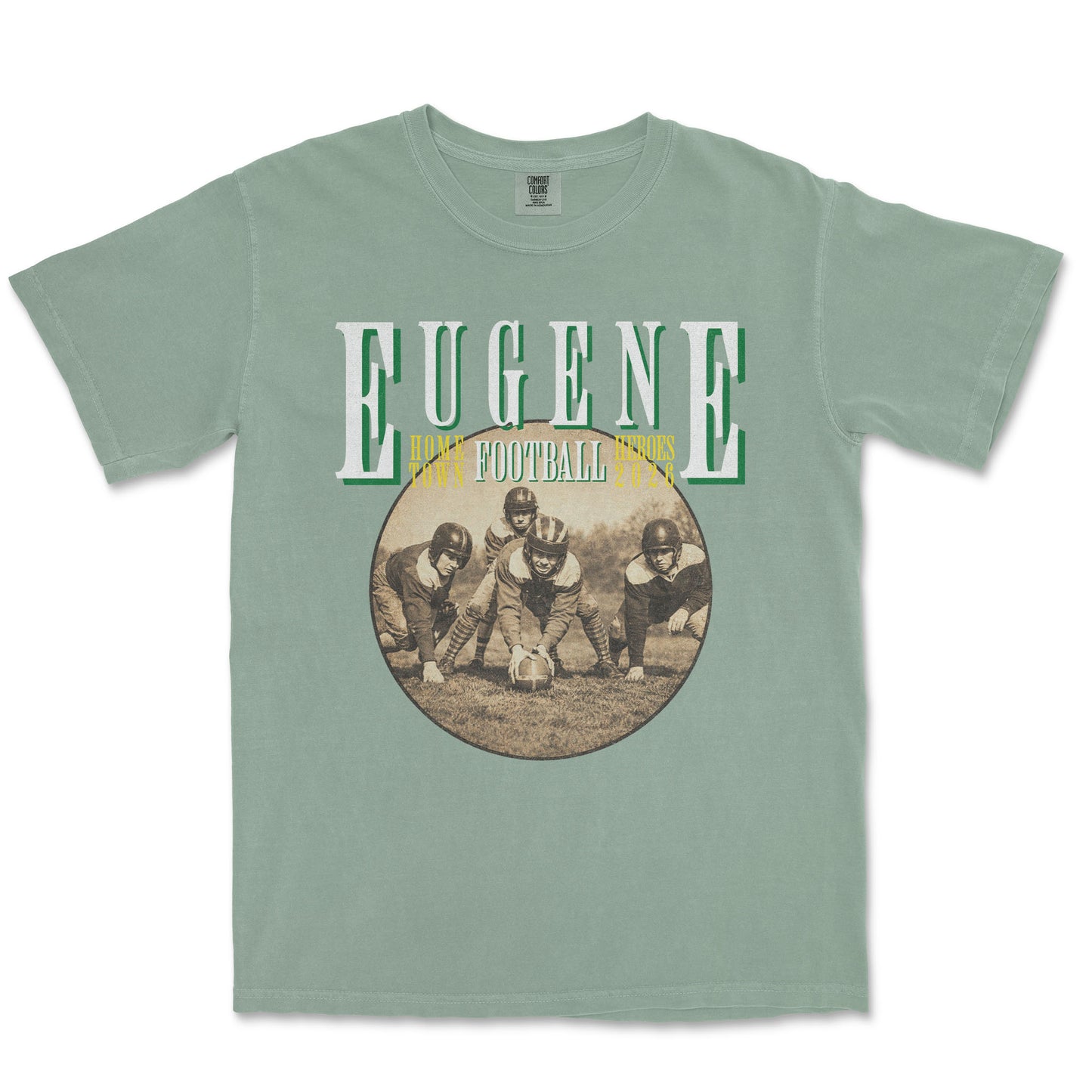 Green t-shirt with vintage football graphic and 'Eugene' text on a white background