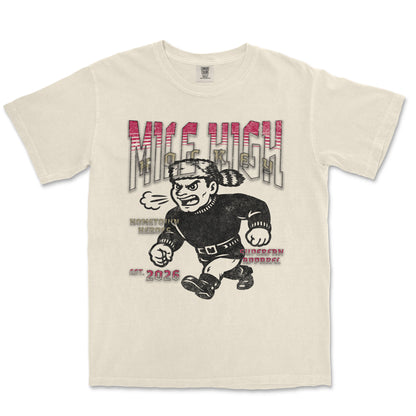 Beige t-shirt with graphic design of a character and text on a white background