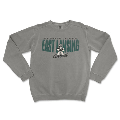 Gray sweatshirt with 'East Lansing Football' text and graphic on a white background