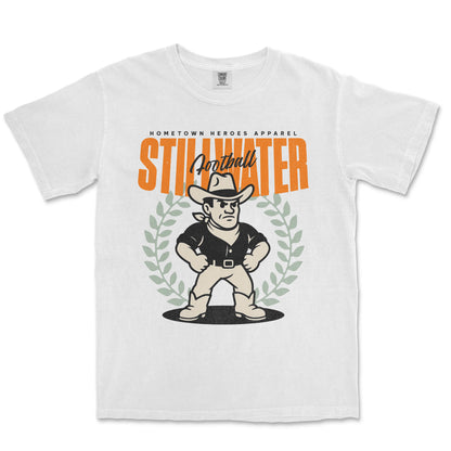 White t-shirt with a graphic of a cartoon cowboy and 'Stillwater' text on a white background