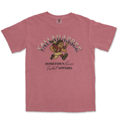 Pink t-shirt with football-themed graphic and text on a white background