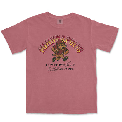 Pink t-shirt with graphic design and text on a white background