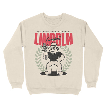 Beige sweatshirt with graphic design of a character holding a football and text 'Hometown Heroes Apparel Lincoln Football'.