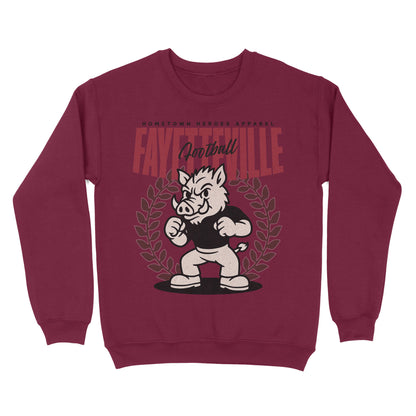 Maroon sweatshirt with a graphic of a boar mascot and text on a white background